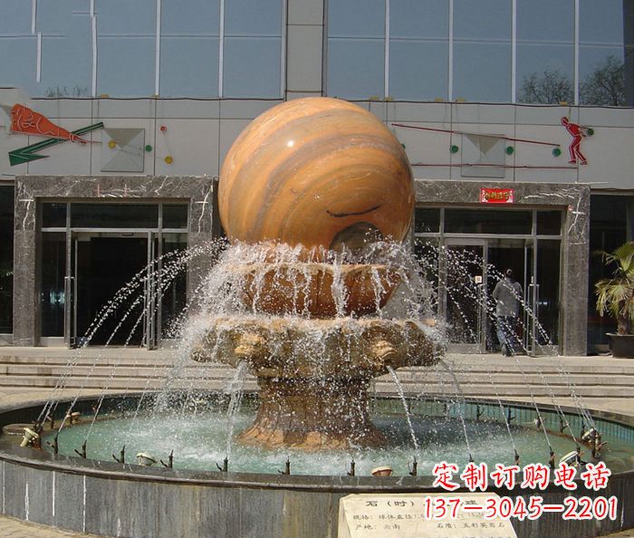 连云港石来运转球晚霞红风水球石雕